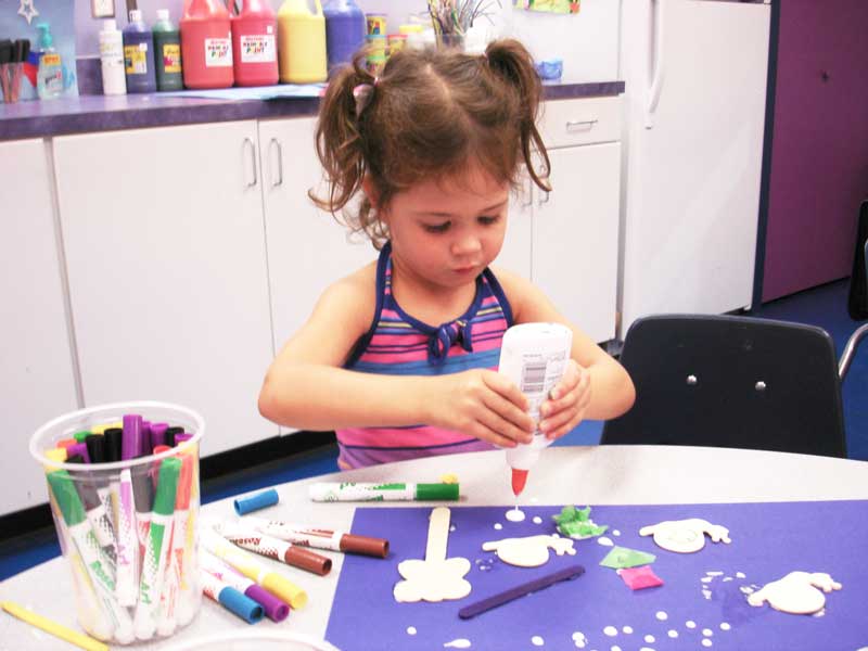 This little girl loves our art classes for kids in Charlotte - Romp n' Roll Northwest Charlotte.