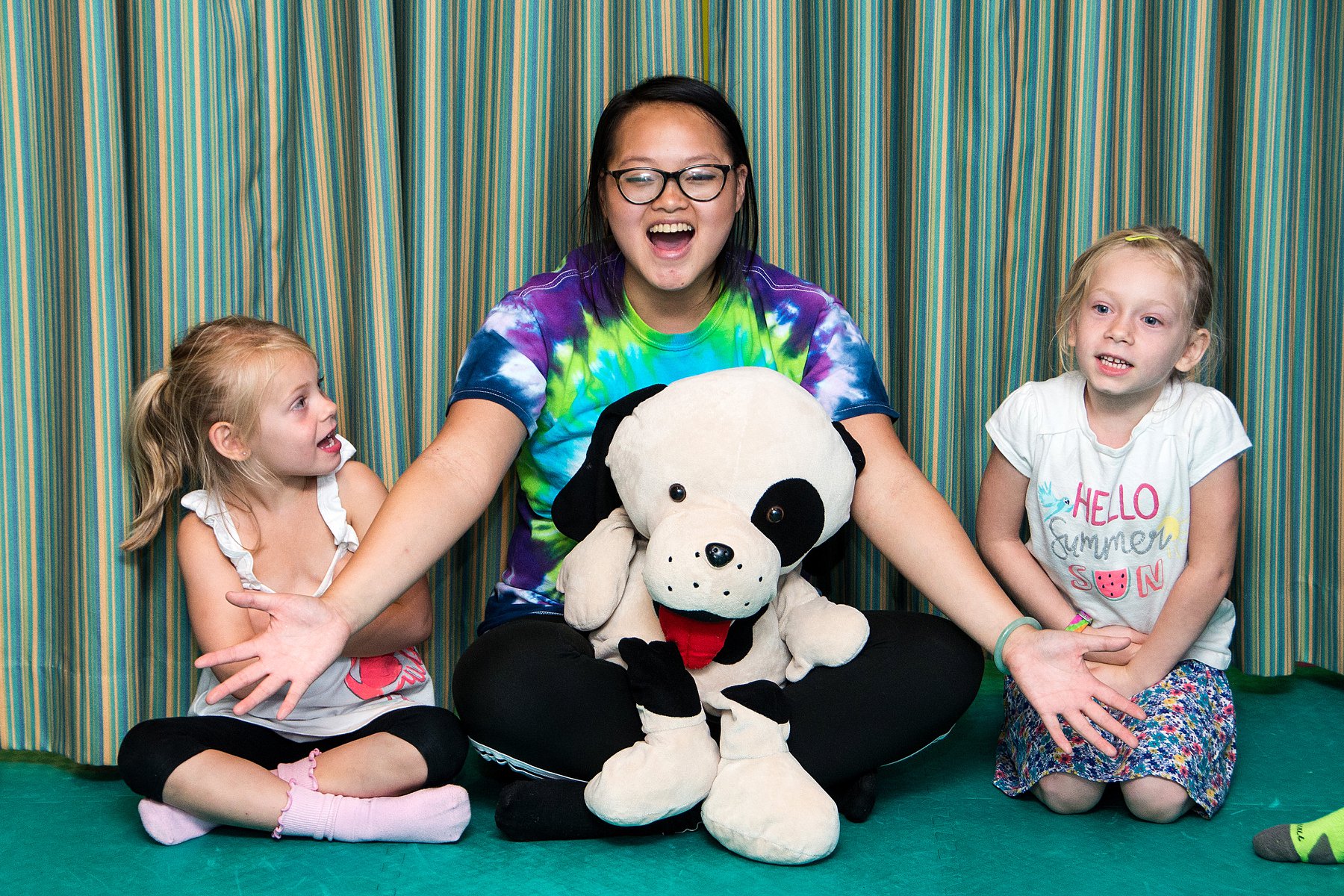 A parent and child smiling at a rompy birthday party, contact us today for rompy's adventure in Katy, TX.