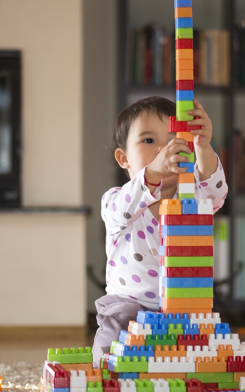 Creating steps with building blocks is a fun way to push your child to learn more at Romp n' Roll.