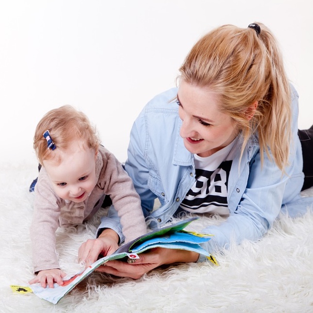 Young child playing by herself in her home - looking for tips on effective communication with you kids? Romp n' Roll in Willow Grove, PA can help!