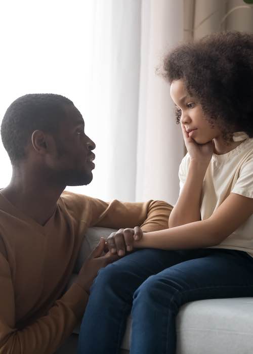 Father talking to daughter helping her learn different coping skills - contact Romp n' Roll Willow Grove to learn effective communication skills.