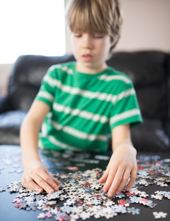 This boy enjoys a jigsaw puzzle on a chilly day thanks to recommendations from Romp n' Roll in Willow Grove, PA.