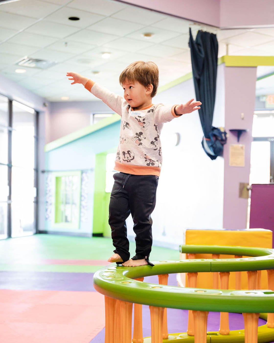 A little bloy playing on Romp n' Roll's indoor playground in Katy, TX.