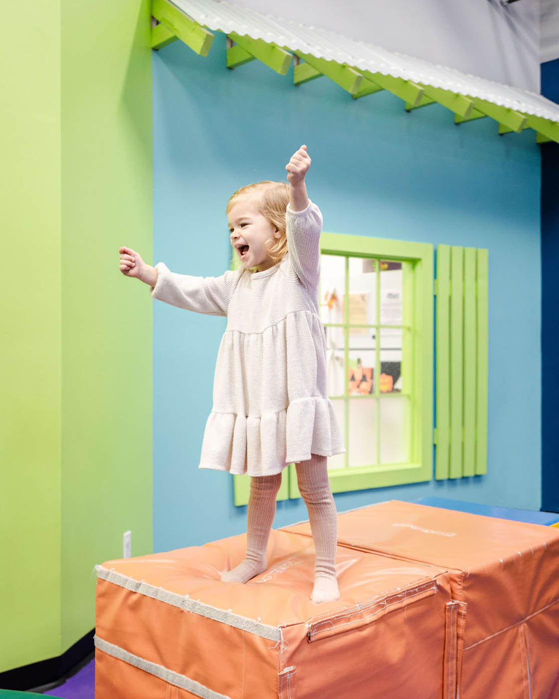 A little girl playing in one of Romp n' Roll Katy's playgroups.