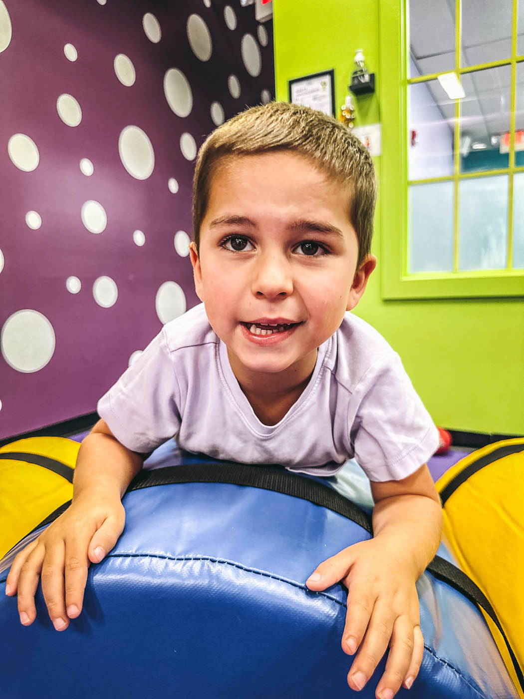 An older boy at Romp n' Roll enjoying preschool classes in Katy, TX.