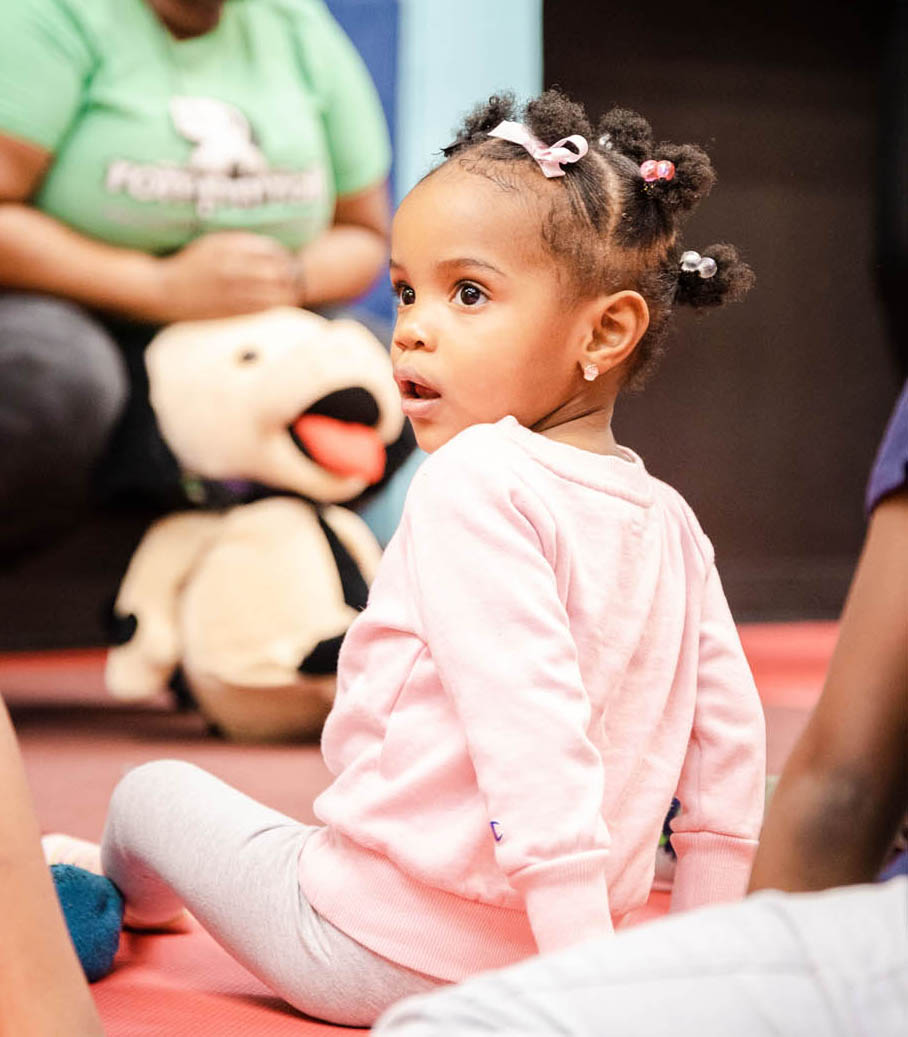 A little girl sitting in a Romp n' Roll facility in Katy.