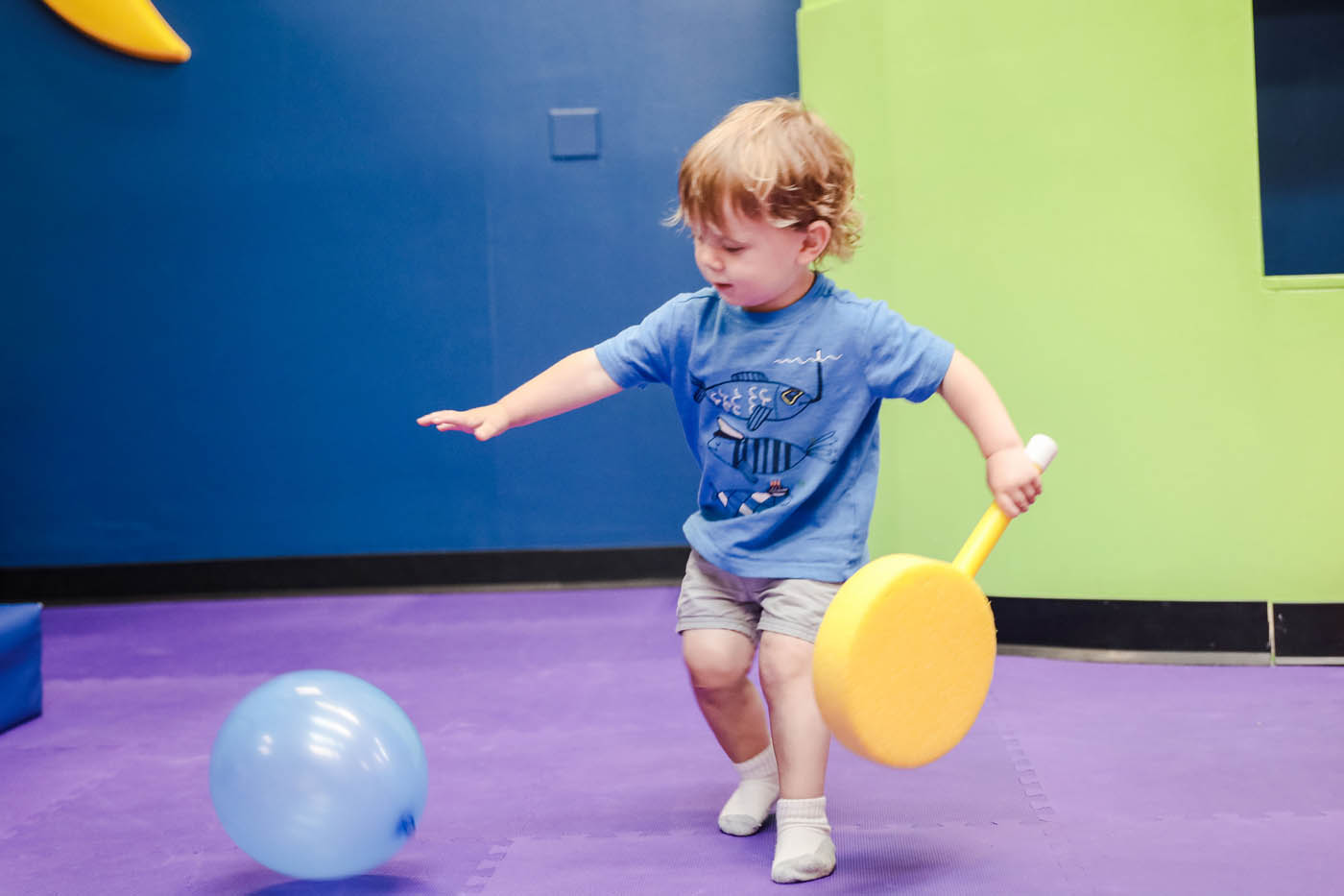 A little boy enjoying Romp n' Roll camp for kids.