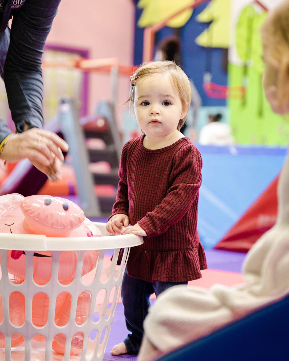 A girl enjoying the toys you can play with at Romp n' Roll.