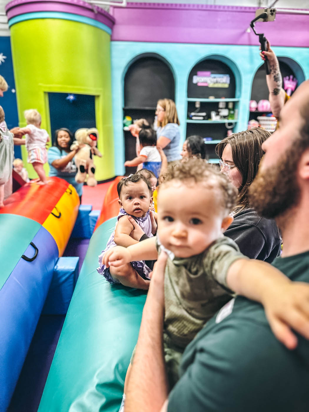 A group of kids and adults at Romp n' Roll at enrichment classes for kdis in Glen Allen, VA.