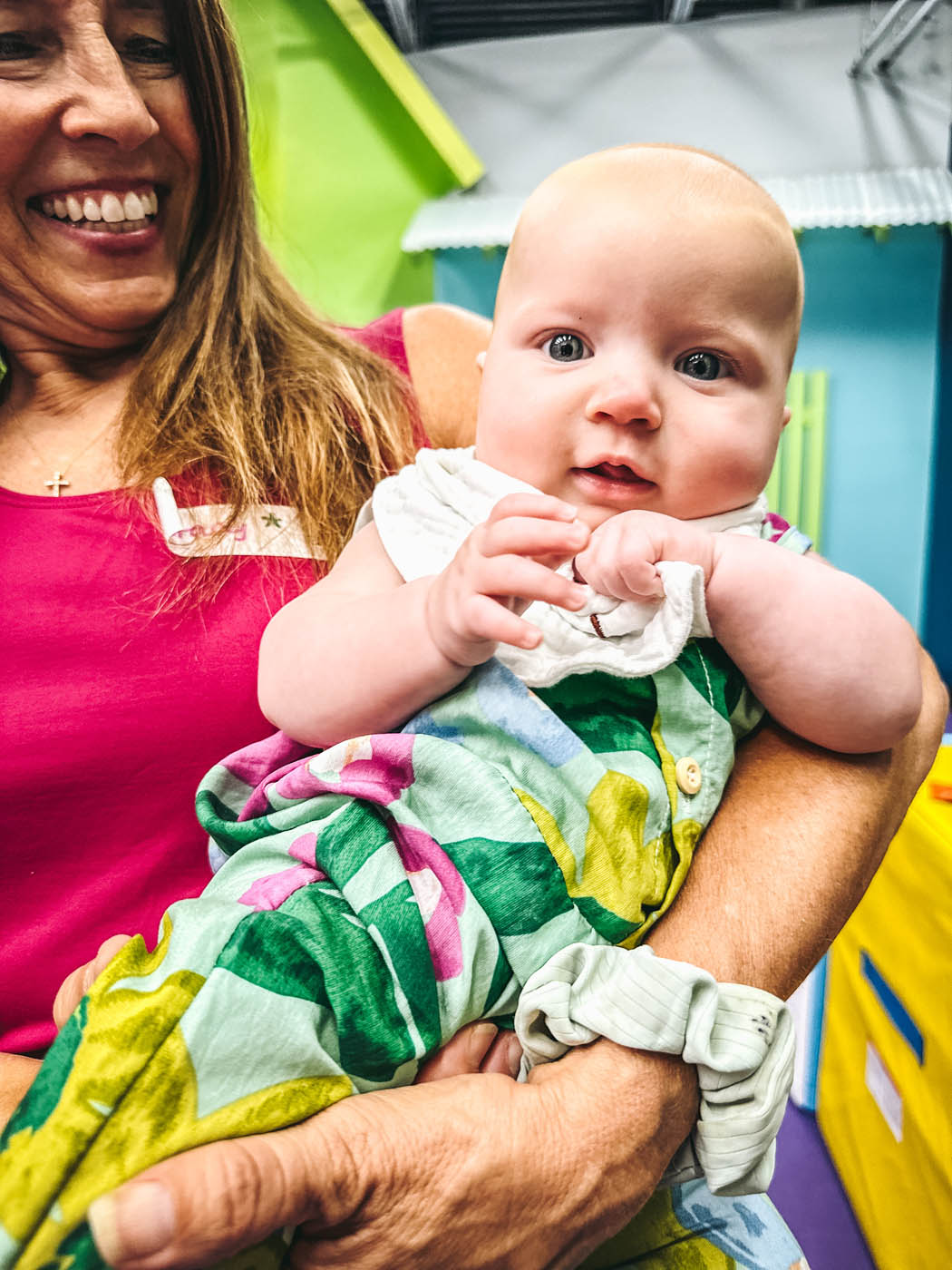 A parent and child laughing while participating at Romp n' Roll Midlothian's class.