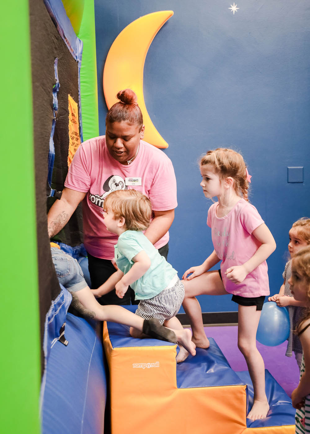 A group of kids going in to adventure our kid-safe equipment at Romp n' Roll in Charlotte.