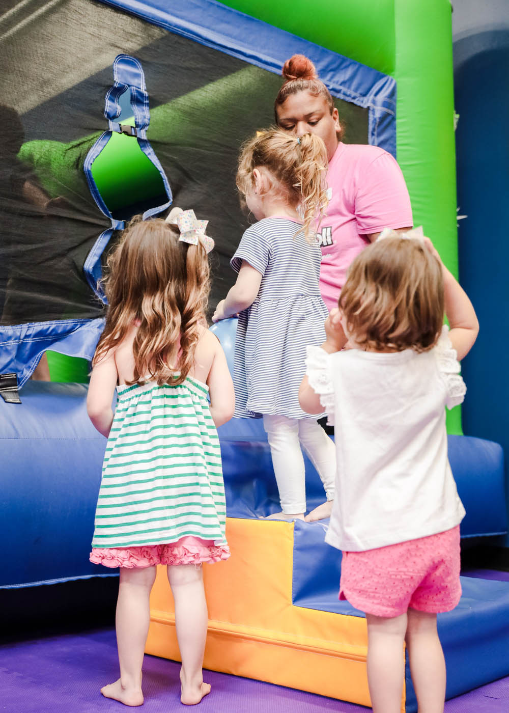 A parent and child playing at Romp n' Roll music class, contact us for kid things to do in Katy, TX.