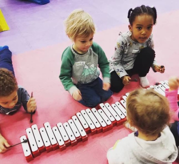 Cute kids learning and enjoying our music classes at Romp n' Roll in Raleigh, NC.