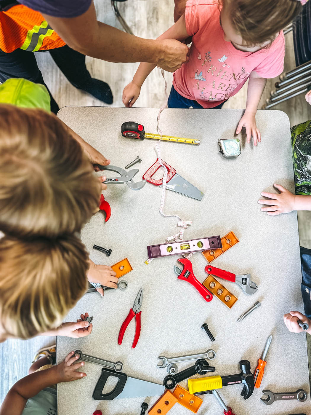 Multiple kids around a table at one of our stem classes for kids in Charlotte, NC.