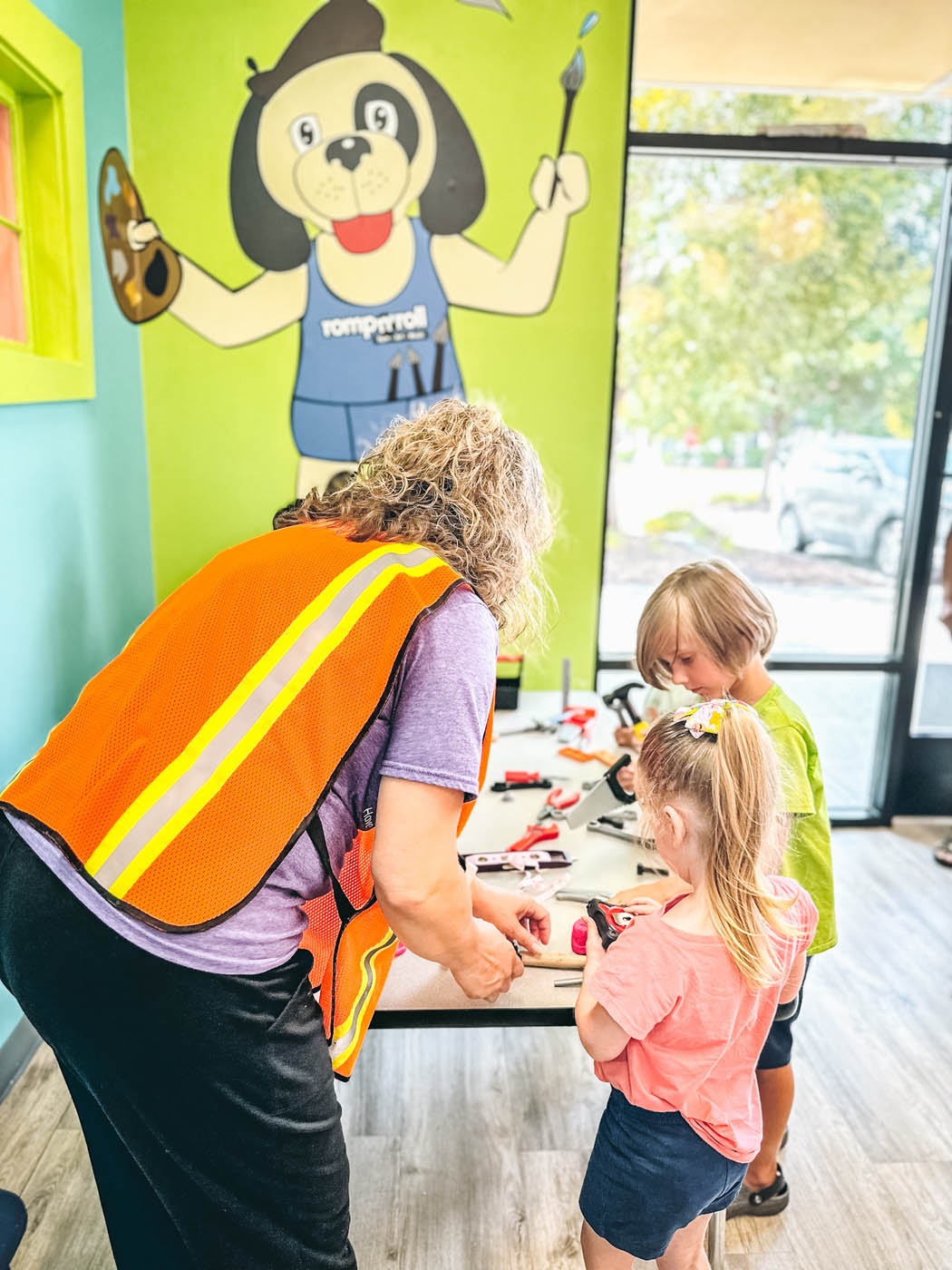 Two kids working with a Romp n' Roll instructor in St. Petersburg.