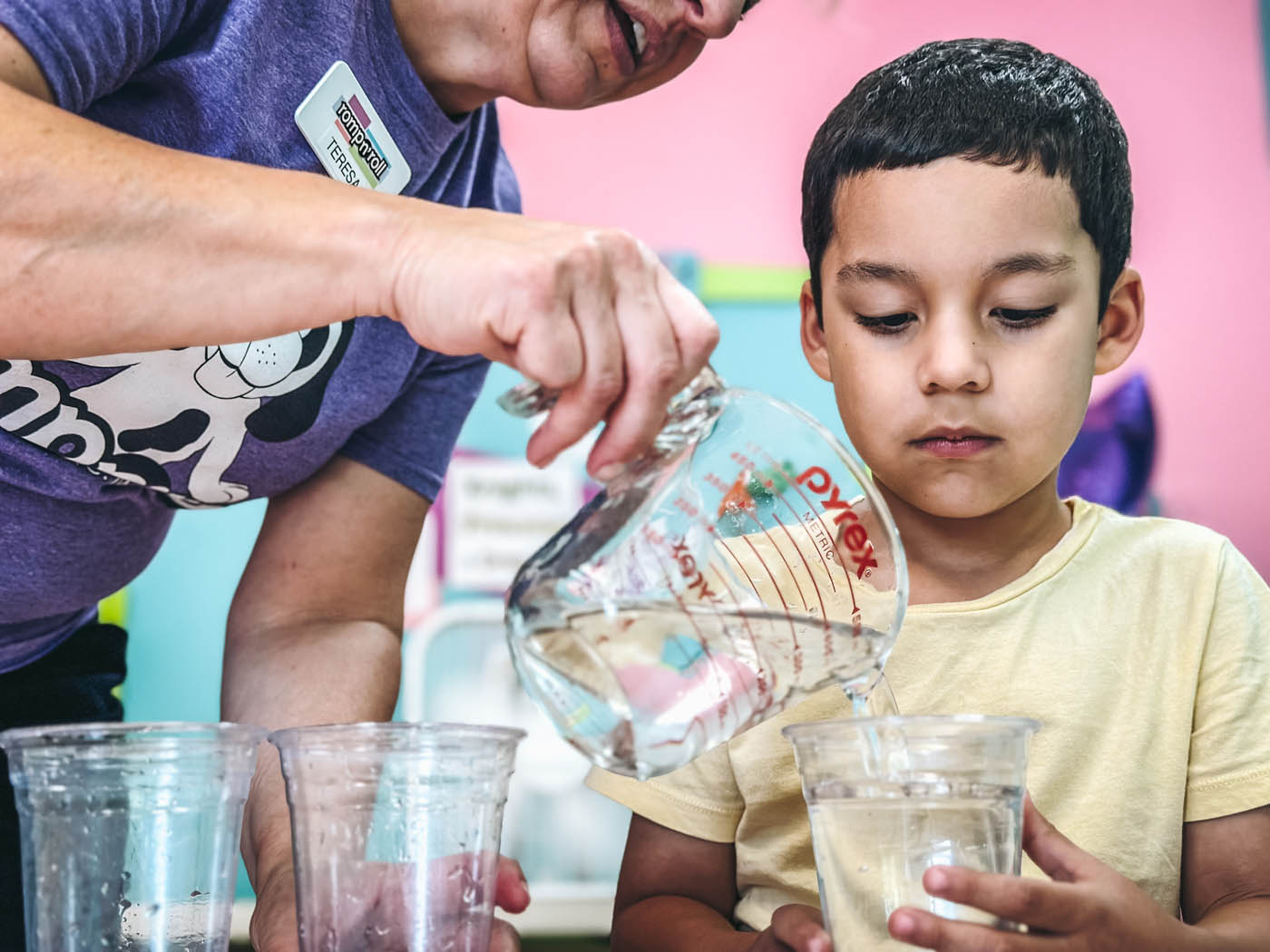 
				A young boy enjoying science class with instructors at Romp n' Roll Midlothian.
			