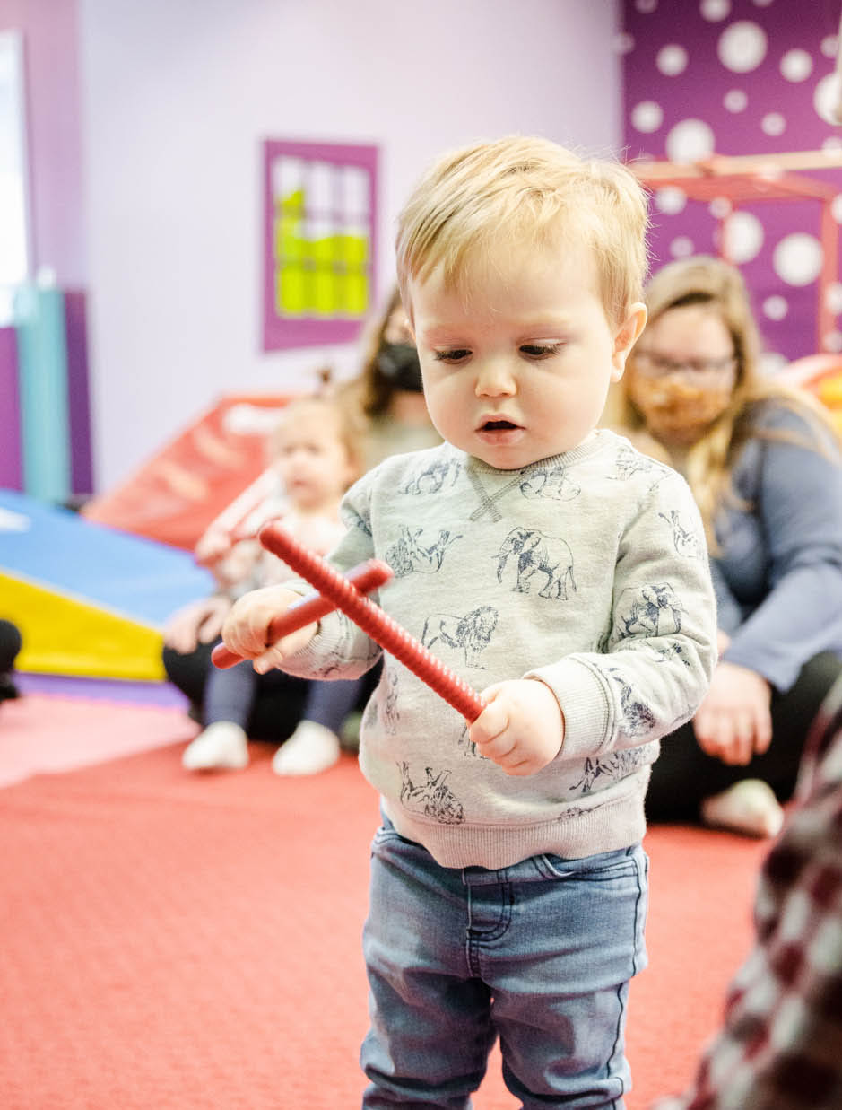 A Romp n' Roll Katy child enjoying a music class.