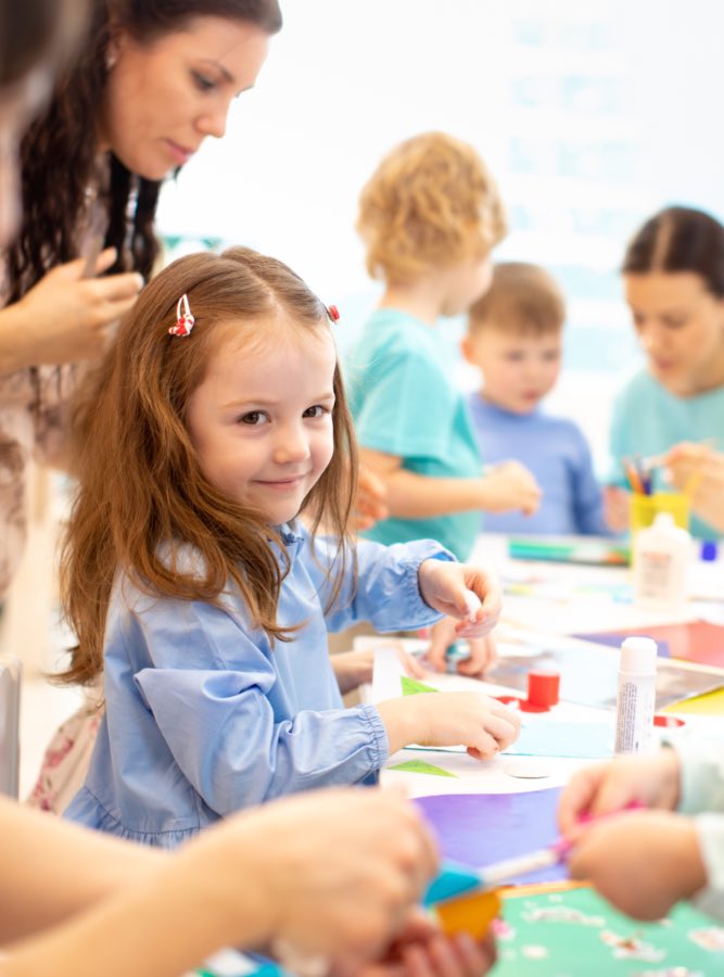 Little girl enjoys sensory play with her mother and classmates at Romp n' Roll in {fran_territory_name, PA.