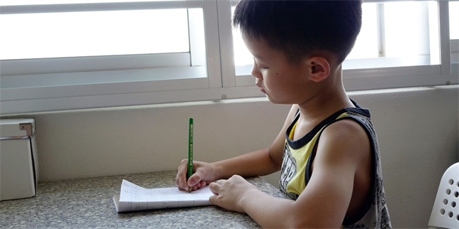 writing boy