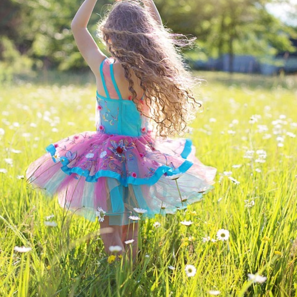 girl dancing in field