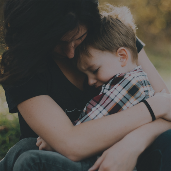 mom comforting son